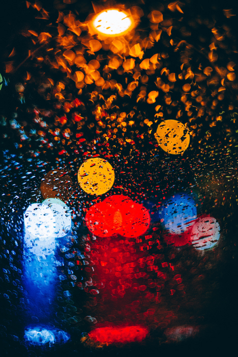 Abstract rain photography shot of colored bokeh lights