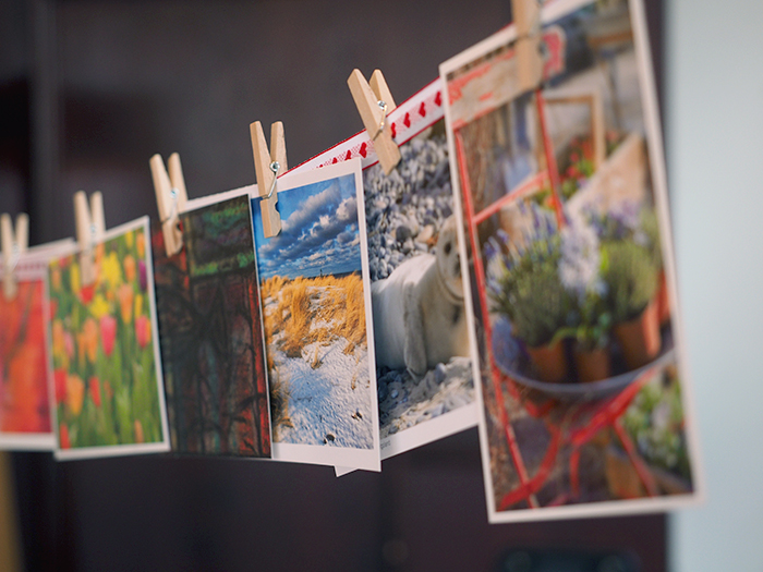 a line of photo prints pegged to a string