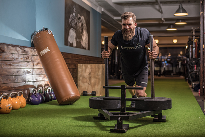 A man working out in the gym for a fitness photoshoot