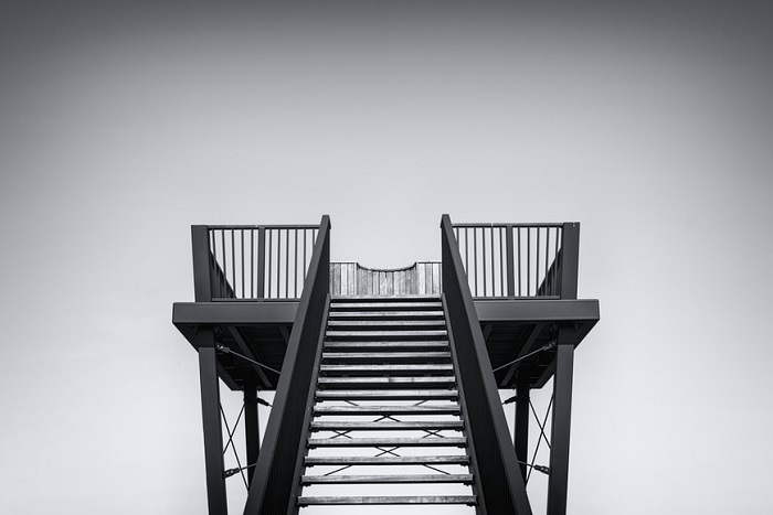 photo of symmetrical staircase in black and white