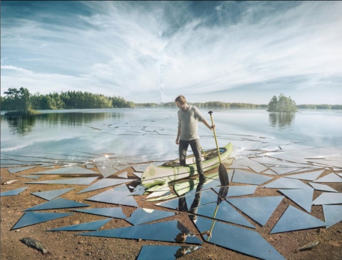 Photo Manipulation Idea of a Man in Kayak on a shattered lake