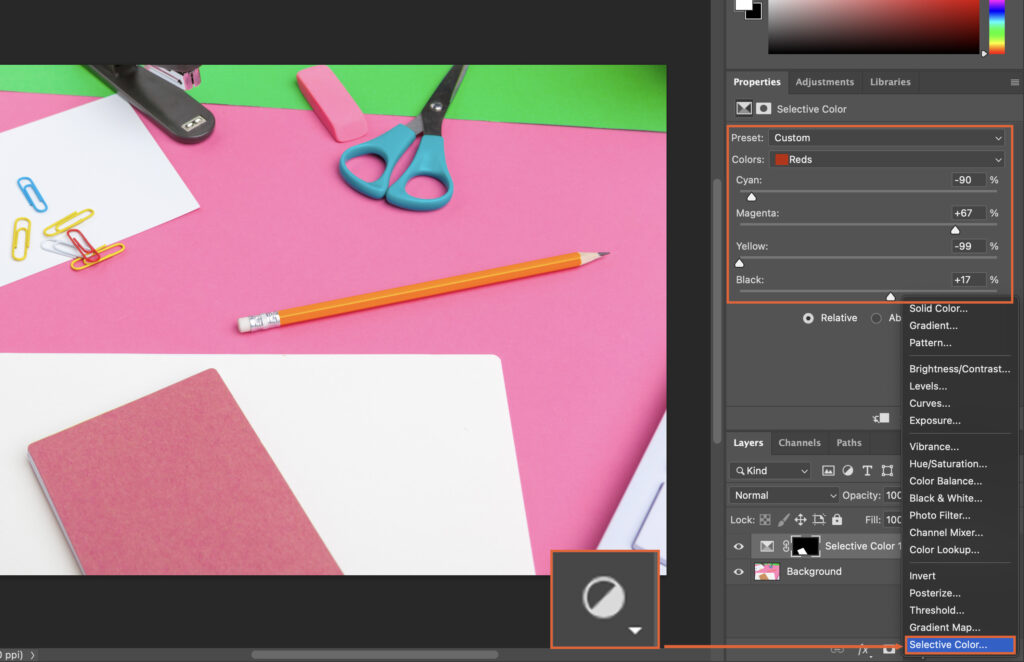 A creative workspace, featuring various art supplies like scissors and pens.